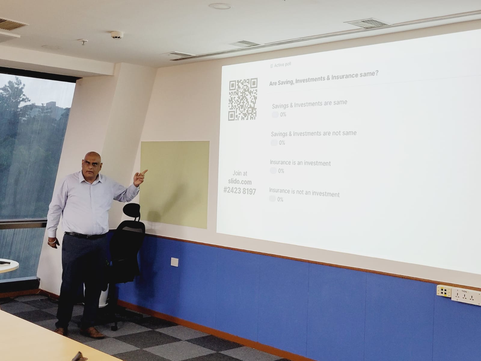 Dr. Handa explaining the difference between savings, investments and insurance