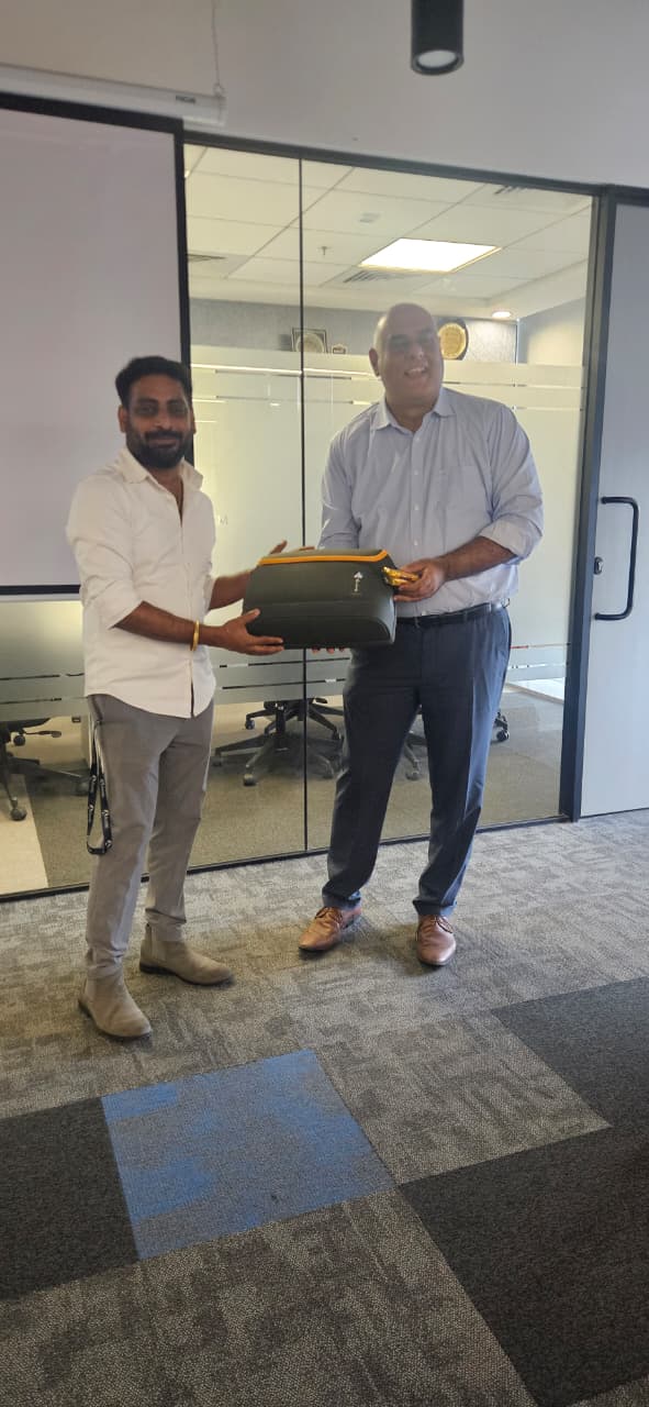 Dr. Handa receiving a token of appreciation from a workshop host